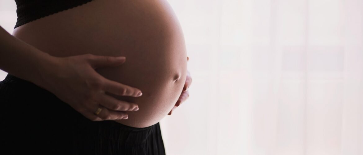 woman holding stomach